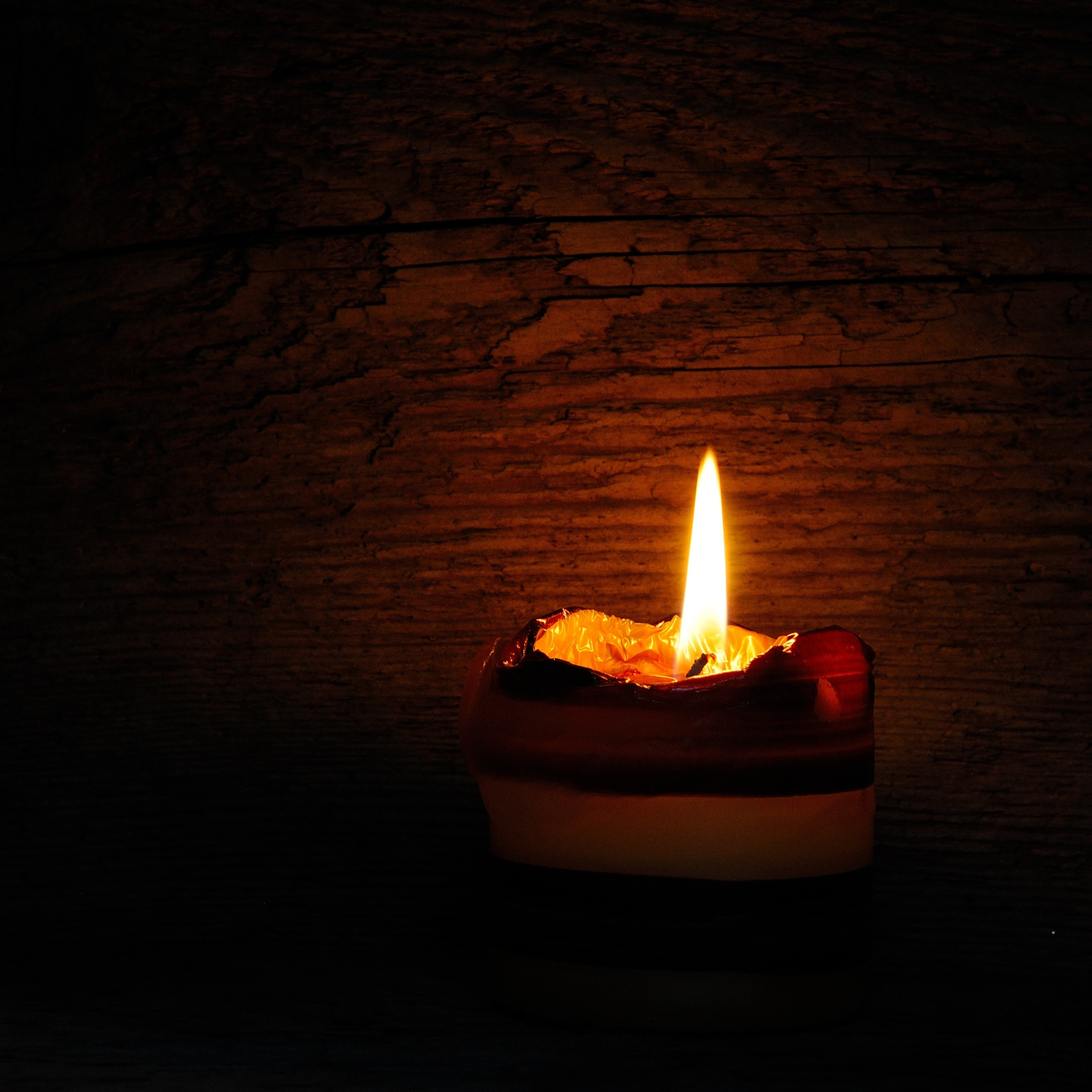 Lit Candle Light Flame in the Dark iPad Wallpaper